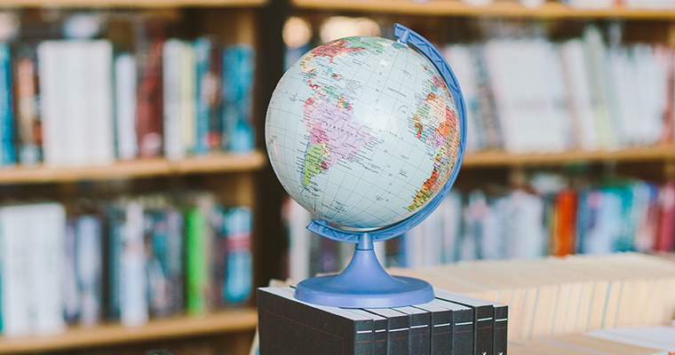Photo of globe on books