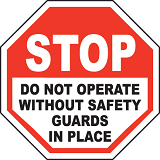 warning sign about not operating machinery without the safety guards in place