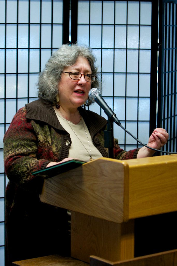 A photo of Kelly Milner Halls speaking at a podium