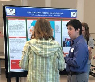 Saul Bautista presents his research proposal poster, Honduran Tribes and their Historical Erosion.
