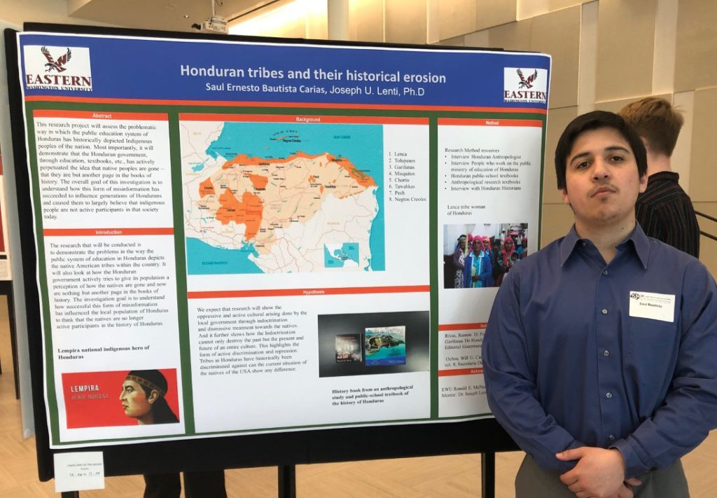 Saul Bautista presents his research proposal poster, Honduran Tribes and their Historical Erosion.