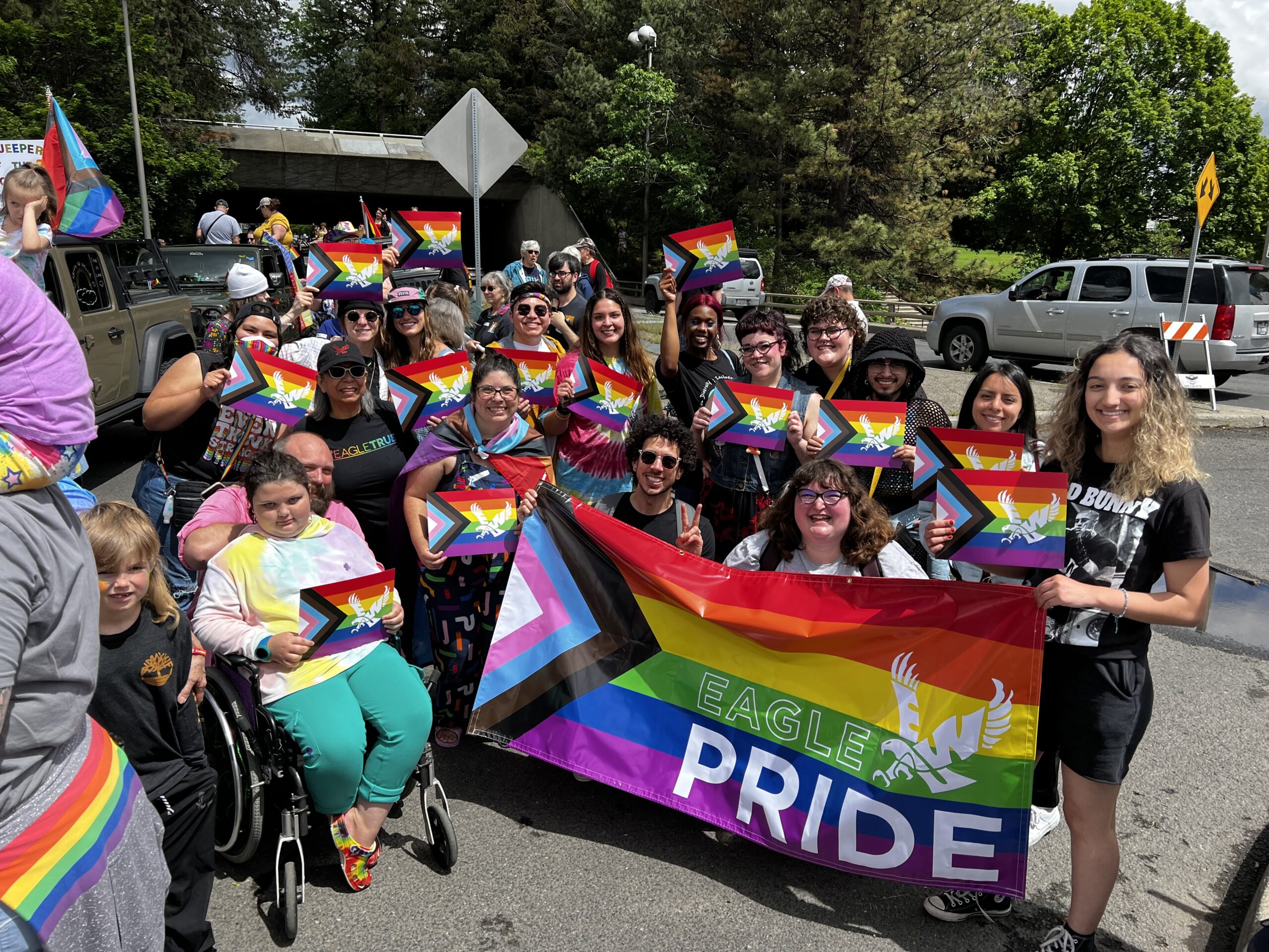 EWU students and staff holding EWU pride banners at a parade