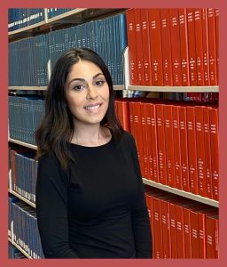 photo of lorin shahinian in front of bookshelves